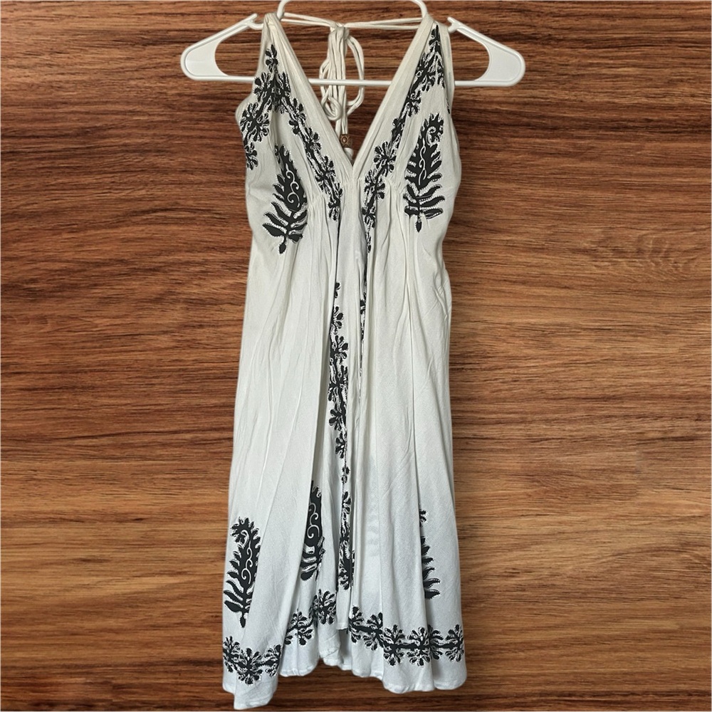 Advance Apparels White Boho Dress with Adjustable Tie Neck & Black Floral Design